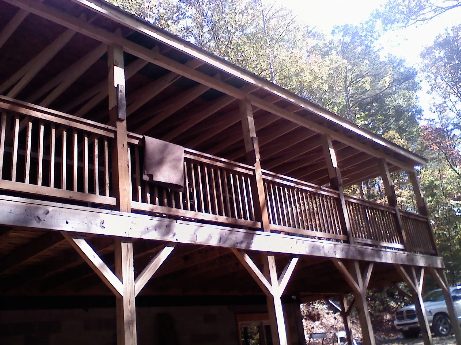 Timber framing under a new elevated porch and deck — Roof Leak Repair in Muscatine by Roofing Brothers